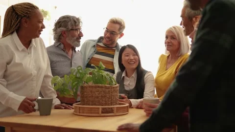 Multiracial people having fun inside home kitchen - Multi-generational friends Stock Footage 178585571