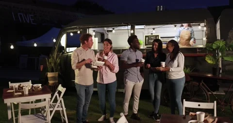 Multiracial people talking in front of food truck outdoor 動画素材 156455232