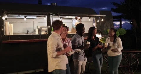Multiracial people talking in front of food truck outdoor 動画素材 156455253