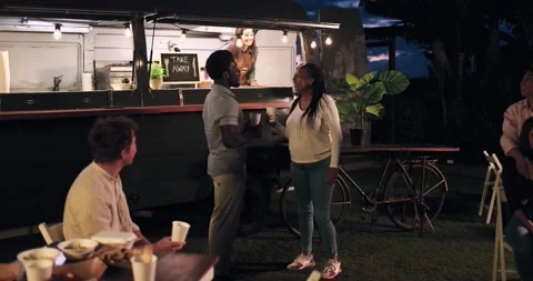 Multiracial people talking together in front of food truck outdoor Stock Footage 156454957