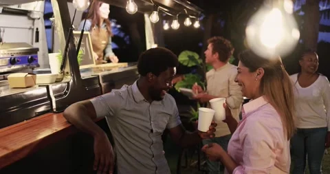 Multiracial people talking together in front of food truck outdoor Stock Footage 156455180