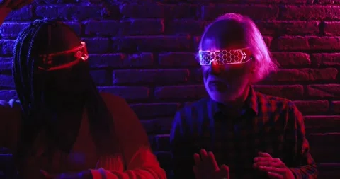 Multiracial senior friends having fun using augmented reality goggles Stock-Footage 174242425