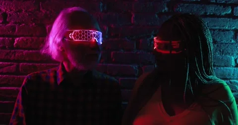 Multiracial senior friends having fun using augmented reality goggles Stock Footage 174244137