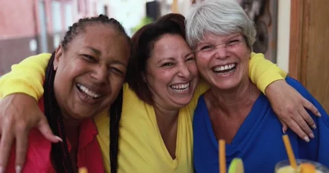 Multiracial senior friends smiling on camera while hugging each others outdoor Stock Footage 162230648