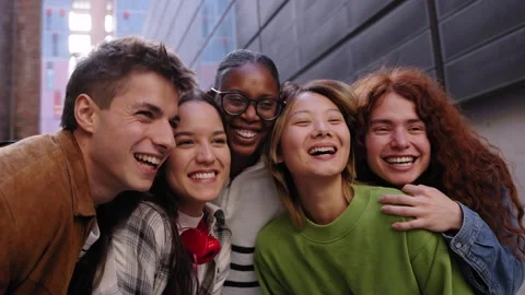 Multiracial student people hugging looking excited together enjoying at Stock Footage 274680427