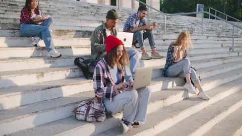 Multiracial Students engage in collaborative learning and social interaction on Stock-Footage 303250081