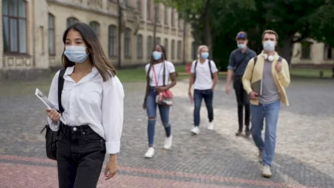 Multiracial students in face masks going to class Stock-Footage 163282132