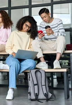 Multiracial students at university campus using gadgets. Exam preparation. Stock-Fotos