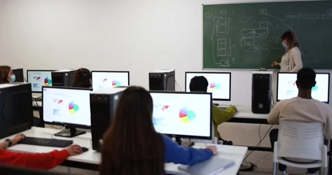 Multiracial students using computers inside class room Video stock 168622507