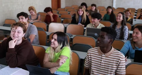 Multiracial students working with laptop computers inside classroom at school Stock Footage 203723660