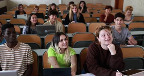 Multiracial students working with laptop computers inside classroom at school Stock Footage 203724084