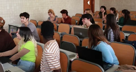 Multiracial students working with laptop computers inside classroom at school Stock Footage 203724160