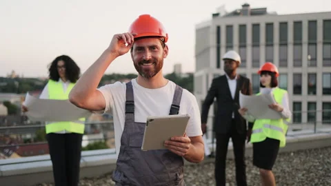 Multiracial team of builders attending construction site Stock Footage 246135340