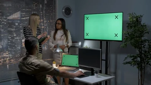 Multiracial team of designers talking about 3D model of personal content on Stock Footage 113046878