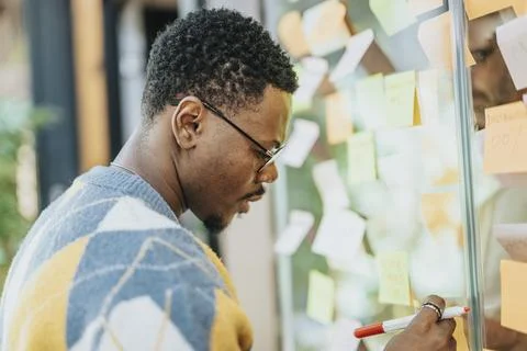 Multiracial team planning, brainstorming, and collaborating in a modern office Stock Photos