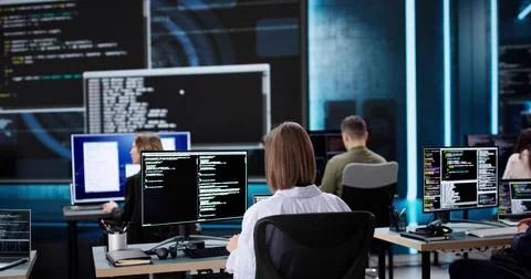 Multiracial Team of Software Engineers Developing Code Stockfoto's