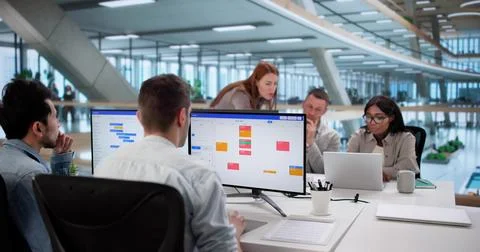 Multiracial Team Using Kanban Board For Agile Software Development Stock Photos