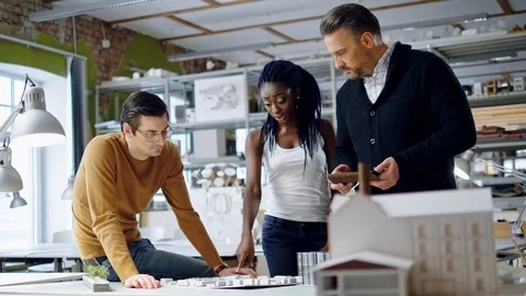 Multiracial team working in design and engineering architecture office. Stock Footage 86361889