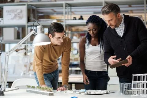 Multiracial team working in design and engineering architecture office Stock Photos