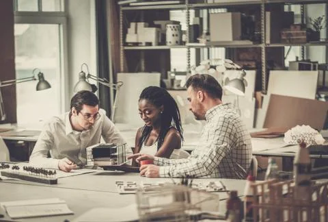 Multiracial team working in design and engineering architecture office Stock Photos