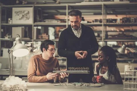 Multiracial team working in design and engineering architecture office Stock Photos