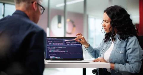 Multiracial Team Of Young Programmers Developing Software In Office Together Stock Photos