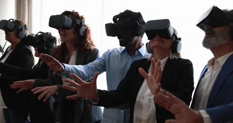 Multiracial teamwork having fun wearing virtual reality headset Stock Footage 172537562