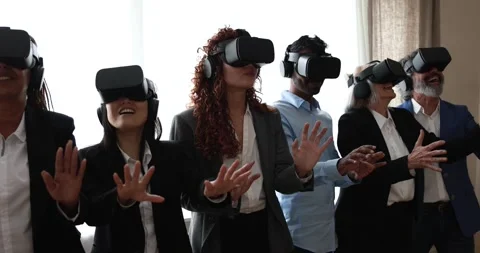 Multiracial teamwork having fun wearing augmented reality headset Видео 172537819