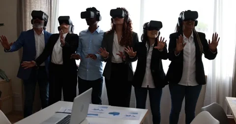 Multiracial teamwork having fun wearing augmented reality headset Stock Footage 172537947