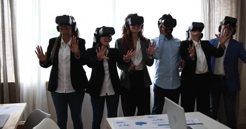 Multiracial teamwork having fun wearing augmented reality headset 動画素材 172537967