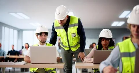The Multiracial Technician: Building A Semiconductor Assembly Machine In Clas Stock Photos