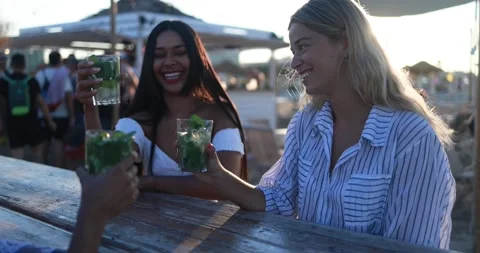 Multiracial women having fun drinking mojitos at beach party outdoor Stock Footage 199235111
