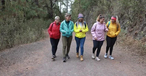 Multiracial women having fun during trekking day into the wood Видео 164377162