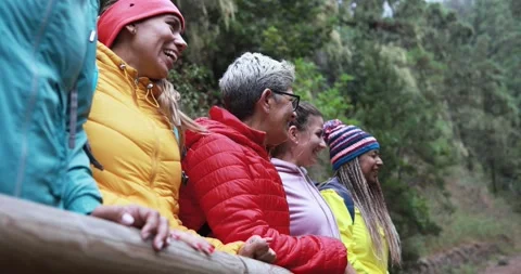 Multiracial women having fun during trekking day into the woods 库存影片 164377707