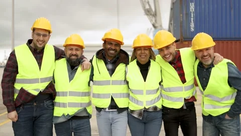 Multiracial worker people having fun inside container cargo terminal at maritime Video stock 182580978