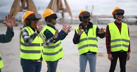 Multiracial workers using virtual reality headsets at industrial terminal Port Stock Footage 179975414