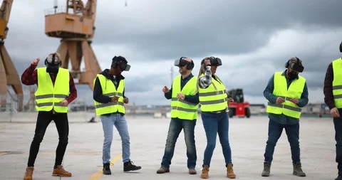 Multiracial workers using virtual reality headsets at industrial terminal Port Stock Footage 179976141