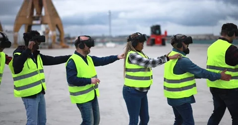 Multiracial workers using virtual reality headsets at industrial terminal Port Stock Footage 179976175