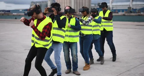 Multiracial workers using virtual reality headsets at industrial terminal Port Stock Footage 179976423