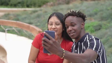 Multiracial young friends having fun taking selfie with mobile phone outdoor Stock Footage 173742259