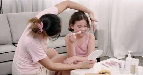Multiracial young girl smiling while holding mirror during slowmotion moment Stock Footage 314278382