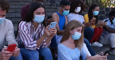 Multiracial young people having fun using mobile phone Stock Footage 158223275