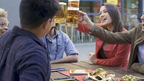 Multiracial young people having fun cheering with beer at brewery bar restaurant Stock Footage 170508289