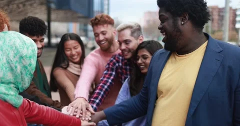 Multiracial young people stacking hands outdoor Stock Footage 175794386
