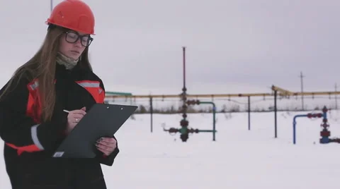 Multiscreen. Female engineer and oil man working together in an oilfield Stock Footage 64232549