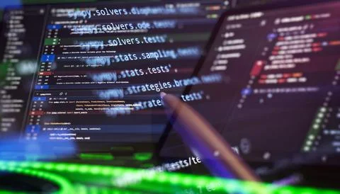 Multiscreen Python development with highlighted code Stock Photos