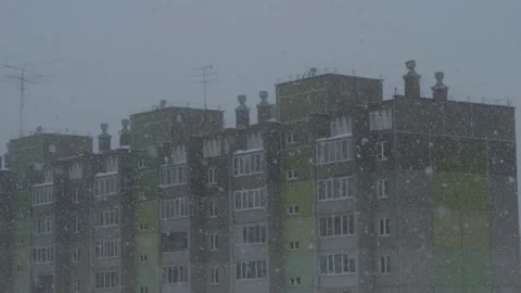 Multistorey panel home, new building on background snow falls. Stock Footage 236246227