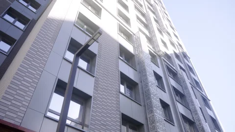 Multistory apartment building facade with mesh elements Stock Footage 330927897