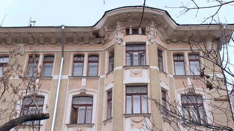 Multistory Building Fragment on the Background Blue Sky. Tree Branches, Video stock 65231224