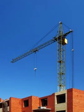 Multistory building under construction with crane Stock Photos